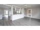 Open-concept kitchen features a breakfast bar and modern vinyl flooring at 1239 Brogden Rd, Smithfield, NC 27577