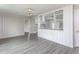 Open-concept living area offering modern vinyl flooring and a breakfast bar at 1239 Brogden Rd, Smithfield, NC 27577