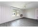 Inviting living area features vinyl floors, lots of natural light, and a ceiling fan at 1239 Brogden Rd, Smithfield, NC 27577