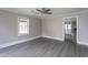 Bright living room features fresh paint, vinyl floors, and a ceiling fan at 1239 Brogden Rd, Smithfield, NC 27577