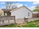 Back of house featuring gray siding, outdoor grill, and limited grass area in backyard at 1304 Drew St, Durham, NC 27701