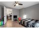 This bedroom features a ceiling fan, wood-look floors, and a doorway view to another room at 1304 Drew St, Durham, NC 27701