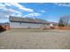 Large backyard with a shed, surrounded by a wood fence and a blue sky overhead at 131 Woodglen Dr, Clayton, NC 27527