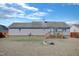 An expansive backyard featuring a wooden deck, a firepit, and ample space for recreation at 131 Woodglen Dr, Clayton, NC 27527