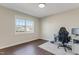 The bedroom has hardwood floors, lots of natural light, and a desk for studying at 131 Woodglen Dr, Clayton, NC 27527