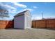 Backyard shed with double doors and gray siding, great for extra storage or a workshop at 131 Woodglen Dr, Clayton, NC 27527