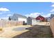 A view of a backyard with a small shed and perimeter fencing on a sunny day at 1312 Big Falls Dr, Wendell, NC 27591