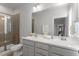 Bathroom features a double sink vanity, a glass-enclosed shower, and modern fixtures at 1312 Big Falls Dr, Wendell, NC 27591