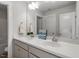 Bathroom featuring double vanity, ample counter space, and a large mirror at 1312 Big Falls Dr, Wendell, NC 27591