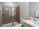 Bathroom showcases a walk-in shower with glass door, a modern vanity, and tiled accents at 1312 Big Falls Dr, Wendell, NC 27591