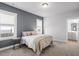 Inviting bedroom with neutral colors, ample natural light, and plush carpeting at 1312 Big Falls Dr, Wendell, NC 27591