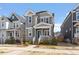 Attractive gray home with well-manicured landscaping, inviting entrance, and a cozy front porch at 1312 Big Falls Dr, Wendell, NC 27591