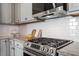 A spacious kitchen with granite countertops, stainless steel appliances, and white subway tile backsplash at 1312 Big Falls Dr, Wendell, NC 27591