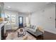 Spacious living room featuring a comfortable sofa, fireplace, and hardwood floors at 1312 Big Falls Dr, Wendell, NC 27591