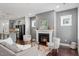 Inviting living room featuring a fireplace, modern furniture, and an open floor plan at 1312 Big Falls Dr, Wendell, NC 27591