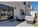 Back patio area featuring outdoor seating and a sliding glass door into the home at 163 Periwinkle Pl, Clayton, NC 27527