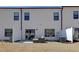 Backyard patio with a stylish sectional sofa and view of the home's exterior at 163 Periwinkle Pl, Clayton, NC 27527