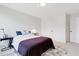 Bedroom with dark accent blanket and small tables on each side at 163 Periwinkle Pl, Clayton, NC 27527