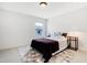 Neutral bedroom with large rug, and a light-filled window at 163 Periwinkle Pl, Clayton, NC 27527