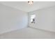 Empty bedroom with plush carpet and a window with a suburban view at 163 Periwinkle Pl, Clayton, NC 27527