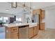 Spacious kitchen with a farmhouse sink, stainless steel appliances, and a large island at 163 Periwinkle Pl, Clayton, NC 27527