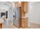 Contemporary kitchen features a stainless steel refrigerator and ample cabinet space at 163 Periwinkle Pl, Clayton, NC 27527