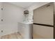Bright laundry room with stainless steel refrigerator and white washer and dryer at 163 Periwinkle Pl, Clayton, NC 27527