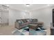 Comfortable living area with a large sectional sofa and geometric area rug at 163 Periwinkle Pl, Clayton, NC 27527