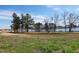Community pond with walking trail along the tree-lined shoreline on a sunny day at 163 Periwinkle Pl, Clayton, NC 27527
