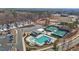 Community center featuring a pool, tennis courts, parking, and new townhomes at 175 Norwell Ln, Pittsboro, NC 27312