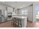 Modern kitchen featuring a spacious island, stainless steel appliances, and sleek gray cabinets at 175 Norwell Ln, Pittsboro, NC 27312
