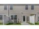 Backyard features a fenced yard, AC Unit, and back door entrance to the home at 176 Starlight St, Sanford, NC 27330