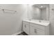 Bathroom featuring double sink vanity with modern fixtures and white cabinets at 176 Starlight St, Sanford, NC 27330