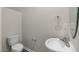 Powder bathroom featuring a pedestal sink and modern fixtures at 176 Starlight St, Sanford, NC 27330