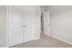 Bedroom featuring a double door closet and minimalist design at 176 Starlight St, Sanford, NC 27330