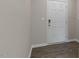 Clean entryway features a white door, gray walls, and wood-look floors at 176 Starlight St, Sanford, NC 27330