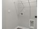 Empty laundry room with utility hookups and tile floor at 176 Starlight St, Sanford, NC 27330