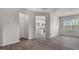 Open-concept living room with wood floors and lots of natural light at 176 Starlight St, Sanford, NC 27330