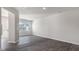 Open-concept living room with kitchen and backyard views at 176 Starlight St, Sanford, NC 27330
