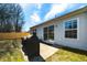 View of a home's backyard featuring an outdoor cooking area and a patio at 1930 Maple Sugar Ln, Fuquay Varina, NC 27526