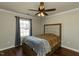 Bedroom featuring hardwood floors, a bed, and a window at 1930 Maple Sugar Ln, Fuquay Varina, NC 27526