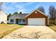 Charming single-story home with a well-manicured front yard and a two-car garage at 1930 Maple Sugar Ln, Fuquay Varina, NC 27526