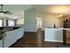 Living room showing an open floor plan with views to the dining room and hallway at 1930 Maple Sugar Ln, Fuquay Varina, NC 27526