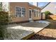 Concrete patio and small wooden deck in the backyard at 209 Tullich Way, Holly Springs, NC 27540