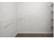 Bright closet with shelves and neutral carpet at 209 Tullich Way, Holly Springs, NC 27540