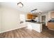 Bright kitchen includes stainless steel appliances, wooden cabinets, granite countertops and a large window at 209 Tullich Way, Holly Springs, NC 27540