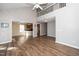 Open concept living area features brick wall, high ceilings, a loft, and wood flooring at 209 Tullich Way, Holly Springs, NC 27540