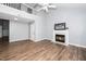 Spacious living room featuring high ceilings, wood floors, and a fireplace with white mantle at 209 Tullich Way, Holly Springs, NC 27540
