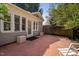 Backyard with patio and view of the home at 212 W University Dr, Chapel Hill, NC 27516