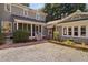Side of house with gravel driveway and screened in porch at 212 W University Dr, Chapel Hill, NC 27516
